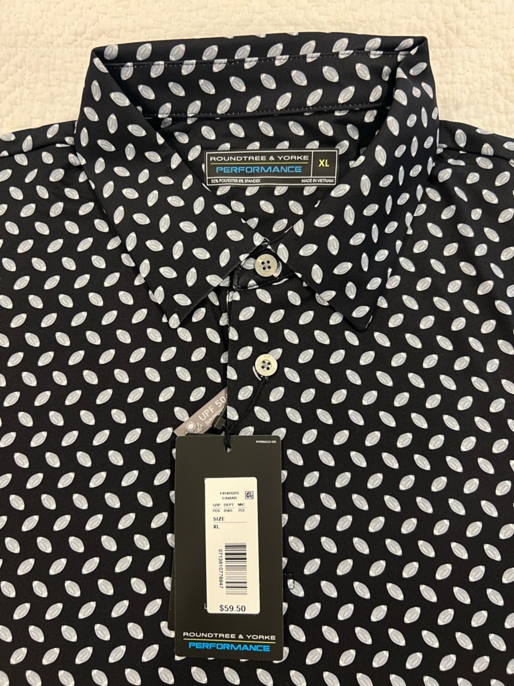 Roundtree & Yorke Men’s Black with White Footballs Performance Stretch Polo